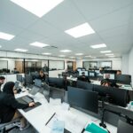 Office workers are busy working on computers.